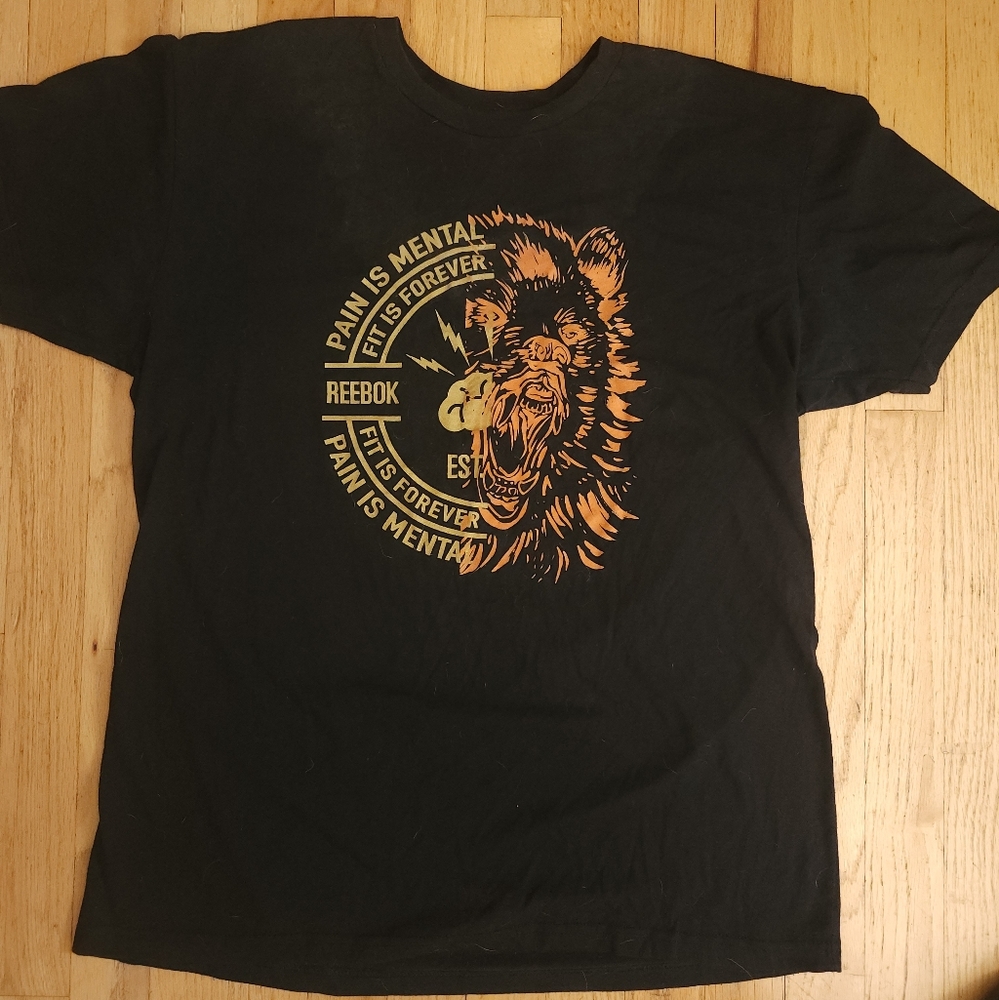 Reebok Graphic Logo Shirt with "Pain is Mental Fit is Forever" and Roaring Bear